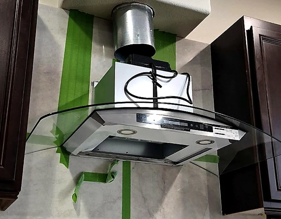 Range hood installation in progress